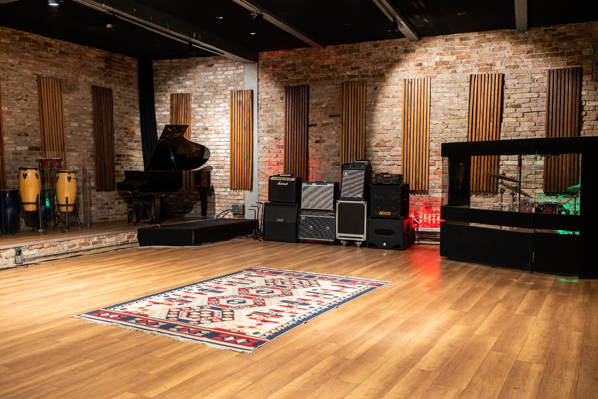 Studio A live room with grand piano, percussion and amp stacks